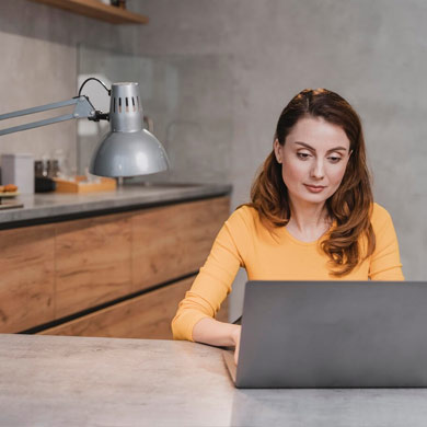 Image of a woman working at office space